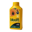 A yellow bottle of bloom Ultra Advanced Floriculture flower enhancer, featuring a dahlia graphic on the label, set against a plain white background.
