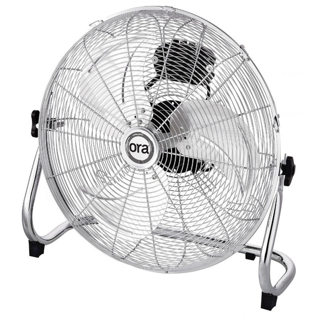 A silver Ora metal floor fan with a wire safety grille, chrome stand, and black accents, featuring the 'ora' brand logo in the center.