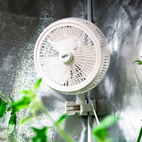 white vortex clip on fan mounted on a grow tent pole