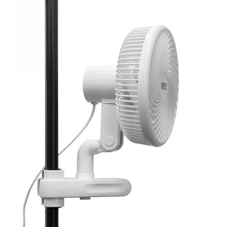 A white wall-mounted electric fan with a protective grille, attached to a white clamp on a black pole, shown against a solid white background.